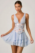Mini-robe corset volantée ornée de motifs floraux bleus