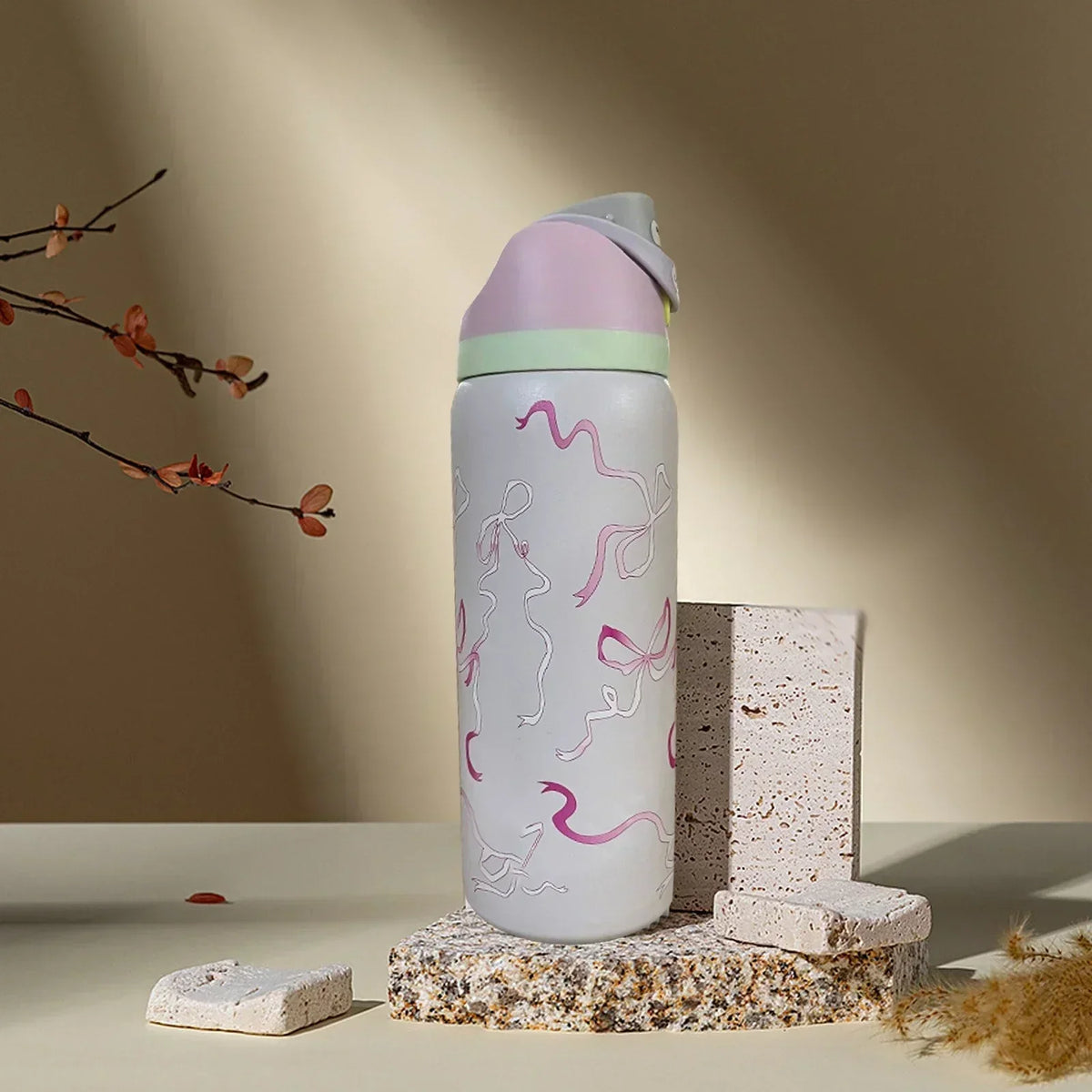 Bouteille d'eau Owala Special Edition en acier inoxydable de 946 ml avec FreeSip, motif nœuds et rubans roses