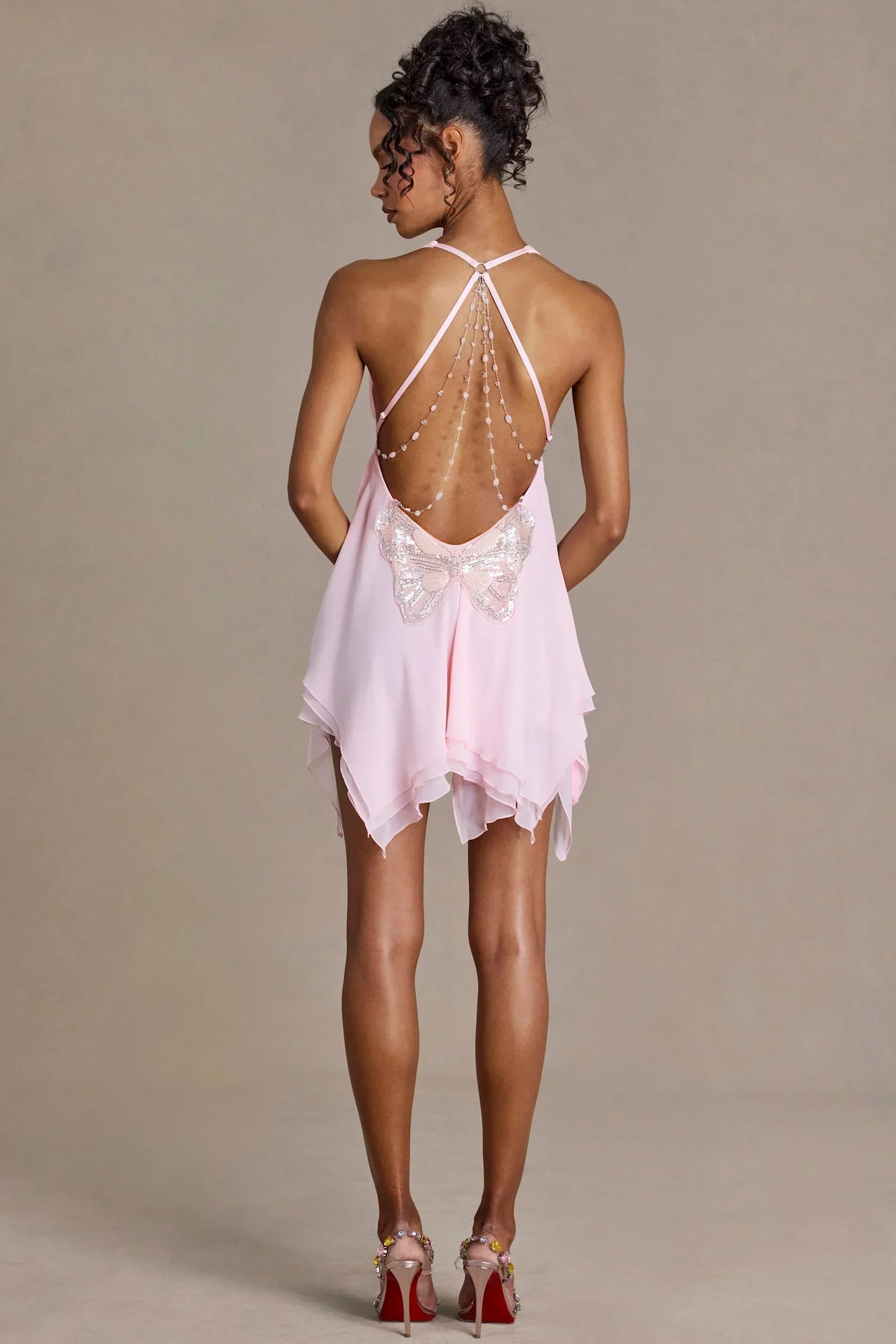 Mini-robe à décolleté plongeant et dos nu en mousseline premium rose bébé